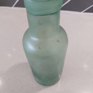 Vintage aqua glass bottle