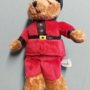 Teddy bear in red jacket
