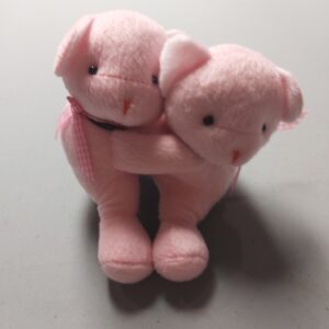Cute pink hugging teddies
